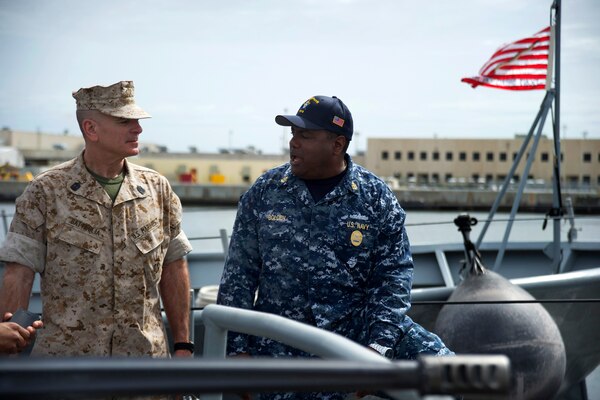 Marine Corps Sgt. Maj. Bryan B. Battaglia, left, senior enlisted advisor to the chairman of the Joint Chiefs of Staff, talks to Navy Chief Petty Officer Bolden about the capabilities of the USS Zephyr on Naval Station Mayport, Fla., April 14, 2014. 