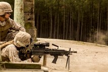A Marine with 8th Engineer Support Battalion, 2nd Marine Logistics Group releases a burst from an M-249 Squad Automatic Weapon during a live-fire range at Camp Lejeune, N.C, April 14, 2014. The battalion spent several hours training its Marines to be proficient with a variety of machine guns they may encounter on the modern battlefield. (U.S. Marine Corps photo by Cpl. Shawn Valosin)