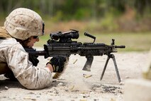 A Marine with Alpha Company, 8th Engineer Support Battalion, 2nd Marine Logistics Group fires an M-249 Squad Automatic Weapon during a machine gun shoot aboard Camp Lejeune, N.C., April 14, 2014. Instructors prepared the company’s Marines for the range by holding several classes before taking to the firing line and engaging targets up to 400 yards away. (U.S. Marine Corps photo by Cpl. Shawn Valosin)