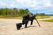 An M-249 Squad Automatic Weapon (SAW) lays in wait at the SR-8 range aboard Camp Lejeune, N.C., April 14, 2014. A few moments later Marines with Alpha Company, 8th Engineer Support Battalion, 2nd Marine Logistics Group used the SAW and other machine guns to lay waste to targets at varying distances. (U.S. Marine Corps photo by Cpl. Shawn Valosin)