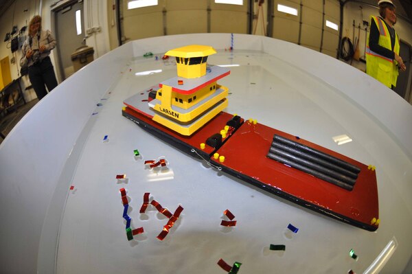 The U.S. Army Corps of Engineers, St. Paul District, celebrated the arrival of its newest vessel, the Model Vessel Curt Larsen, with a christening ceremony at Lock and Dam 2 in Hastings, Minn., April 16. The MV Larsen was commissioned as a working boat by the district's public affairs office in 2013 to assist in the accomplishment of the district's community relations misson. The Larsen will be used to tow demonstration loads in the district's lock model. It was named after district lock operator Curt Larsen, who manufactured the boat. He created the vessel to be able to withstand thousands of children playing with it for a number of years.