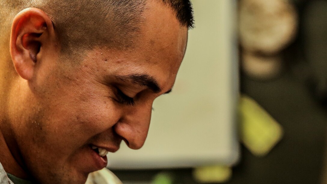 Sergeant Sigilfredo Garcia, small-arms technician, 15th Marine Expeditionary Unit, inspects the bolt of an M4 carbine aboard Camp Pendleton, Calif., April 11, 2014. Garcia, 26, is from Watsonville, Calif. (U.S. Marine Corps photo by Cpl. Emmanuel Ramos/Released)