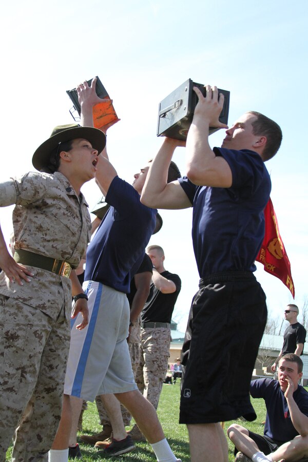 U.S. Marine Corps Staff Sgt. Rosa Rivera, a drill instructor from Marine Corps Recruit Depot Parris Island S.C., helps prepare future Marines of Recruiting Station Frederick for the training procedures they will experience at recruit training during RS Frederick’s annual pool function April 12, 2014. The pool function was held to build camaraderie and the physical fitness of the poolees before they attend recruit training. (U.S. Marine Corps photo by Amber Williams/Released)