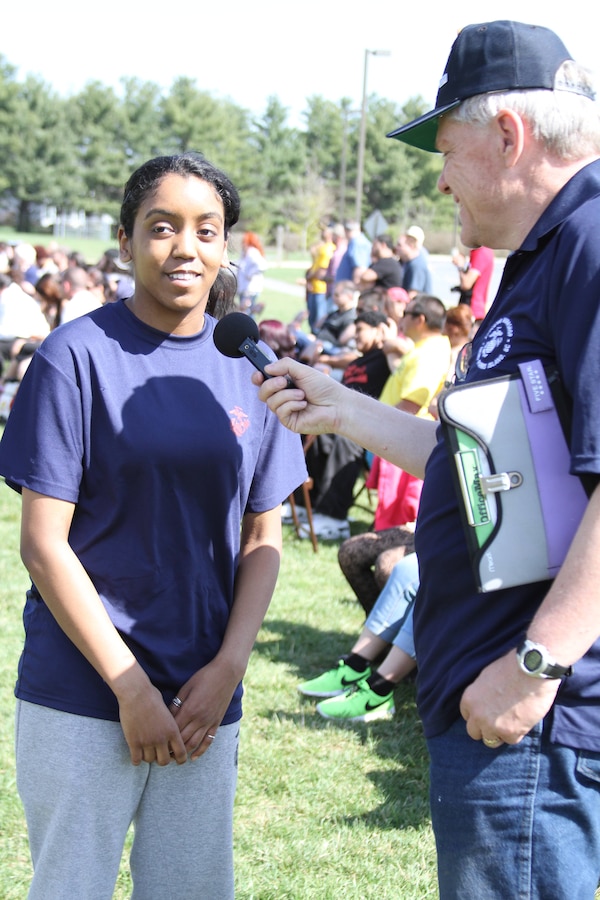 Recruiting Station Frederick’s Poolee Nicolle Bruno, a student at Virginia Common Wealth University, Va., talks to Al McGilvray, a reporter with WRNR News Talk Radio, about her experience at the RS Frederick’s annual pool function April 12, 2014. The pool function was held to build camaraderie and the physical fitness of the poolees before they attend recruit training. Bruno is in the Delayed Entry Program where she has a specific amount of time to wait before going to recruit training and trying her hand at becoming a U.S. Marine. (U.S. Marine Corps photo by Sgt. Amber Williams/Released)
