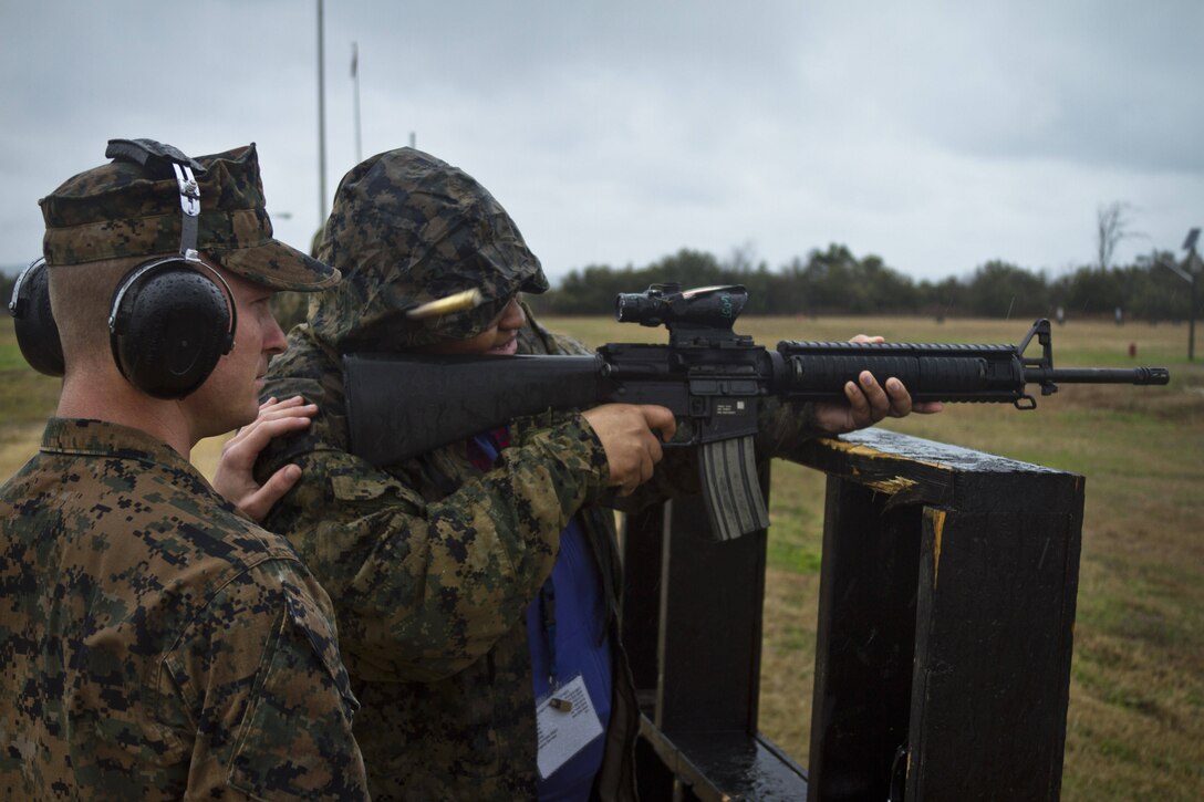 April Powell, right, a guidance counselor at Snow Hill High School in Snow Hill, MD, fires a M16A4 service rifle during the first day of Recruiting Station Baltimore’s Educators Workshop at Marine Corps Recruit Depot Parris Island, S.C. The Educators Workshop is a four-day event that is intended to offer educators a practical knowledge of the Marine Corps and impress upon them the continual need to recruit highly qualified men and women. (U.S.
Marine Corps photo by Sgt. Bryan Nygaard/Released)
