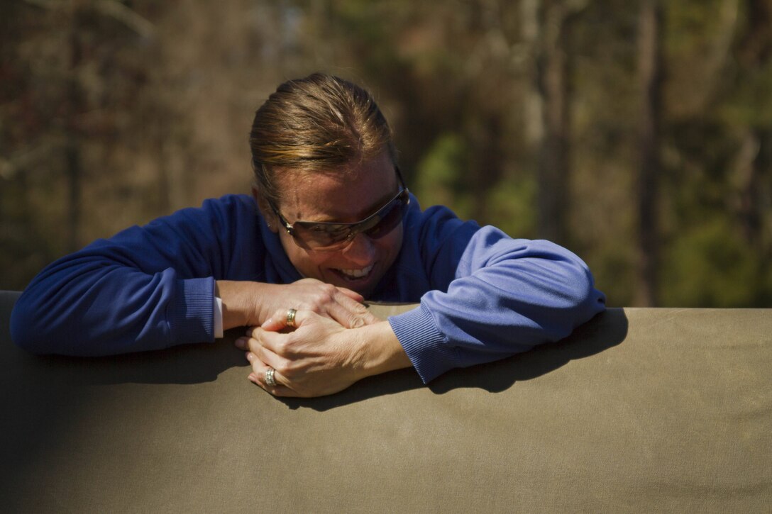 Shelley McGuire, a resource teacher at Eastern Technical High School in Baltimore, Md., negotiates an obstacle on the confidence course during the second day of Recruiting Station Baltimore’s Educators Workshop at Marine Corps Recruit Depot Parris Island, S.C. The Educators Workshop is a four-day event that is intended to offer educators a practical knowledge of the Marine Corps and impress upon them the continual need to recruit highly qualified men and women. (U.S. Marine Corps photo by Sgt. Bryan Nygaard/Released)