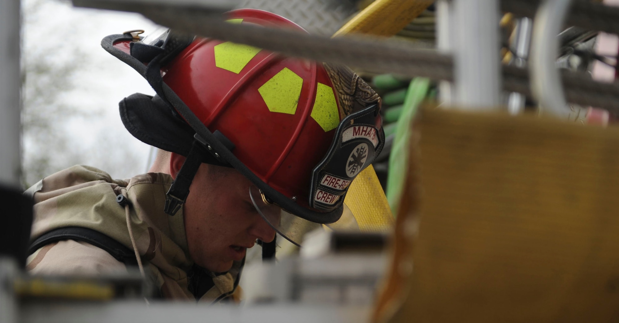 Staff Sgt. Richard Jones, 366th Civil Engineer Squadron firefighter, returns a fire hose after a simulated fire during Sharpshooter 14-02, a base-wide exercise April 16, 2014, Mountain Home Air Force Base, Idaho. Airmen have the opportunity to improve on their day-to-day skills as well as protective postures during exercises such as this. (U.S. Air Force photo by Airman 1st Class Malissa Lott/RELEASED)