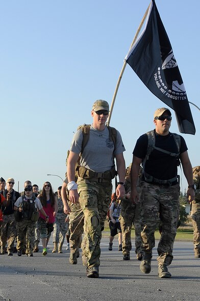 More than 350 joint military forces, civilian government employees and their families participate in an 8.5-mile march on Kadena Air Base, Japan, April 12, 2014, to commemorate the prisoners of war who served in the Battle of Bataan in the Philippines during World War II. The POWs had to endure a death march of more than 60 miles with no food or water provided for five days. (U.S. Air Force photo by Senior Airman Marcus Morris)