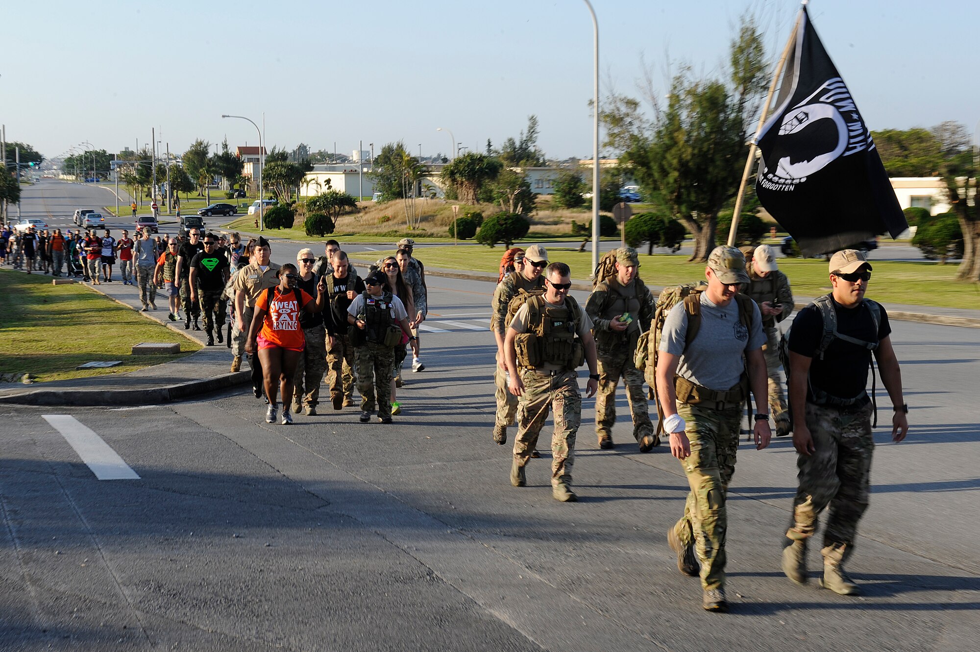 Joint military forces, government civilian employees and their families participate in an 8.5-mile march on Kadena Air Base, Japan, April 12, 2014. The Bataan Memorial Death March honors the American and Filipino servicemen who defended the island of Luzon in the Philippines in 1942 and had to endure a death march of more than 60 miles. (U.S. Air Force photo by Senior Airman Maeson L. Elleman)