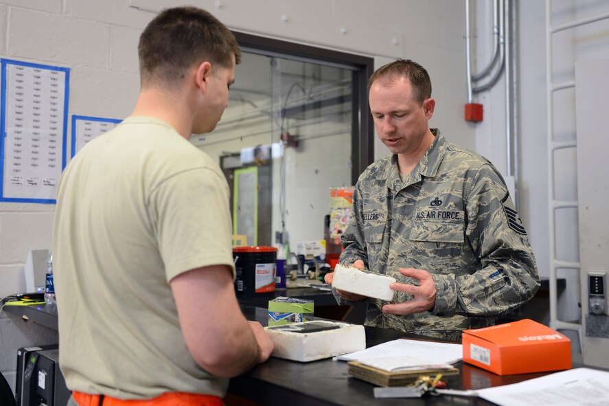 Master Sgt. Marc Sellers (right), 62nd Maintenance Squadron fabrication flight chief, reviews tool control and accountability procedures with Staff Sgt. Kyle Baldini, 62nd MXS aircraft structural maintenance journeyman, April 8, 2014 at Joint Base Lewis-McChord, Wash. During 2013, Sellers prepared 38 aircraft for nuclear airlift support helping the 62nd Airlift Wing earn the highest Department of Defense level nuclear surety inspection rating. (U.S. Air Force photo/Airman 1st Class Jacob Jimenez)      