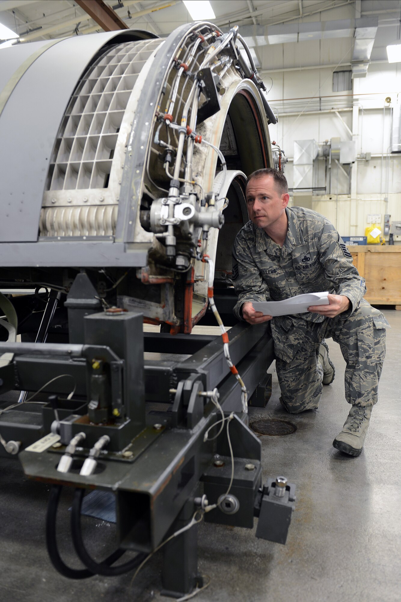 Master Sgt. Marc Sellers, 62nd Maintenance Squadron fabrication flight chief, reviews repair procedures for a C-17 Globemaster III thrust reverser’s doors April 8, 2014 at Joint Base Lewis-McChord, Wash. Sellers was recently notified by Air Mobility Command that he would represent the senior non-commissioned officer category for the 12 Outstanding Airmen of the Year competition, he should find out in July if he was selected. (U.S. Air Force photo/Airman 1st Class Jacob Jimenez) 