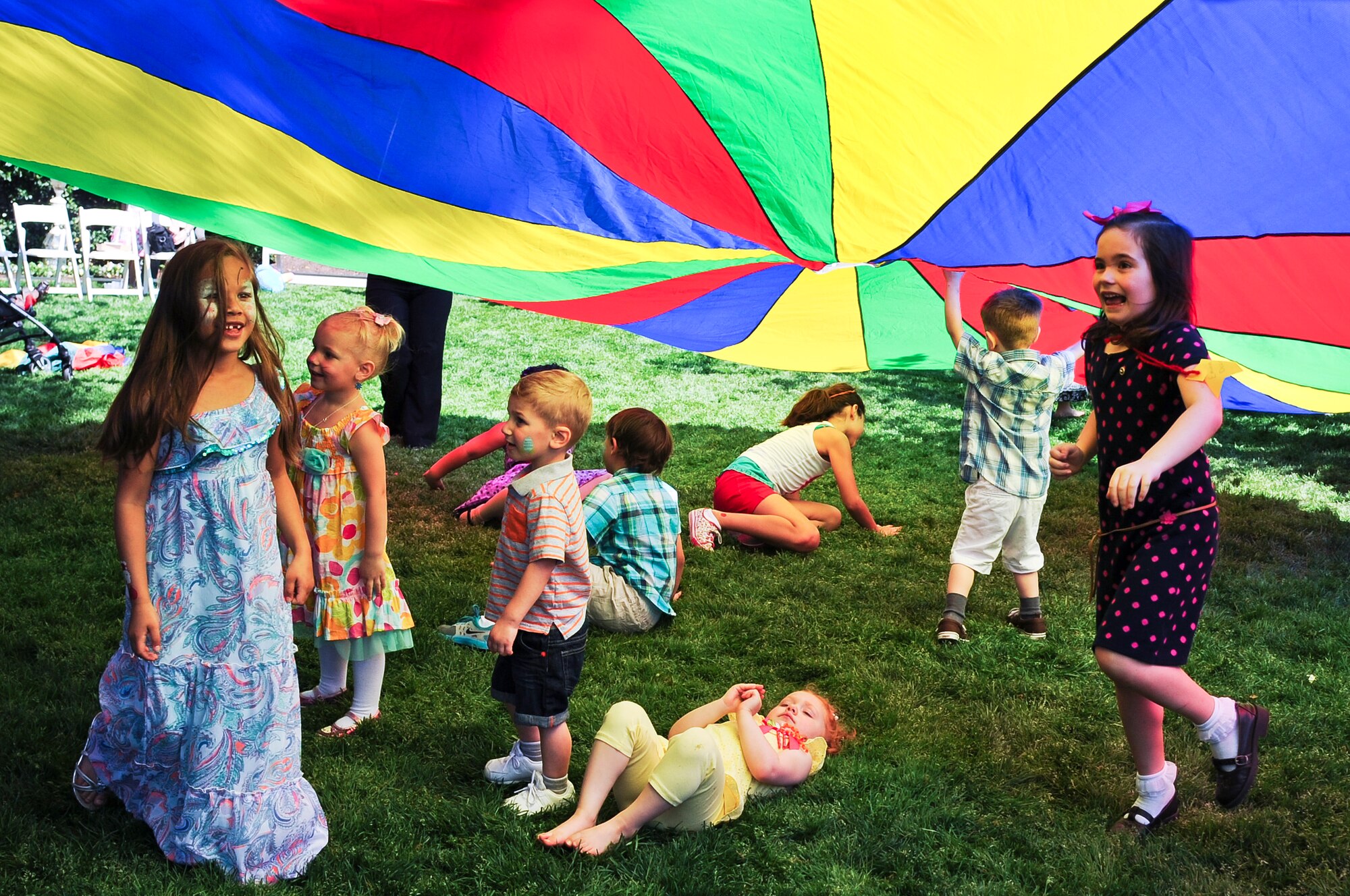 Children play under a parachute during the Easter egg hunt April 12, 2014, at the Governor’s Executive Mansion in Raleigh, N.C. Ann McCrory, North Carolina’s First Lady, hosted the event to promote the Month of the Military Child by recognizing the children of the members of the U.S. Armed Forces. (U.S. Air Force photo/Tech. Sgt. Colette M. Graham)