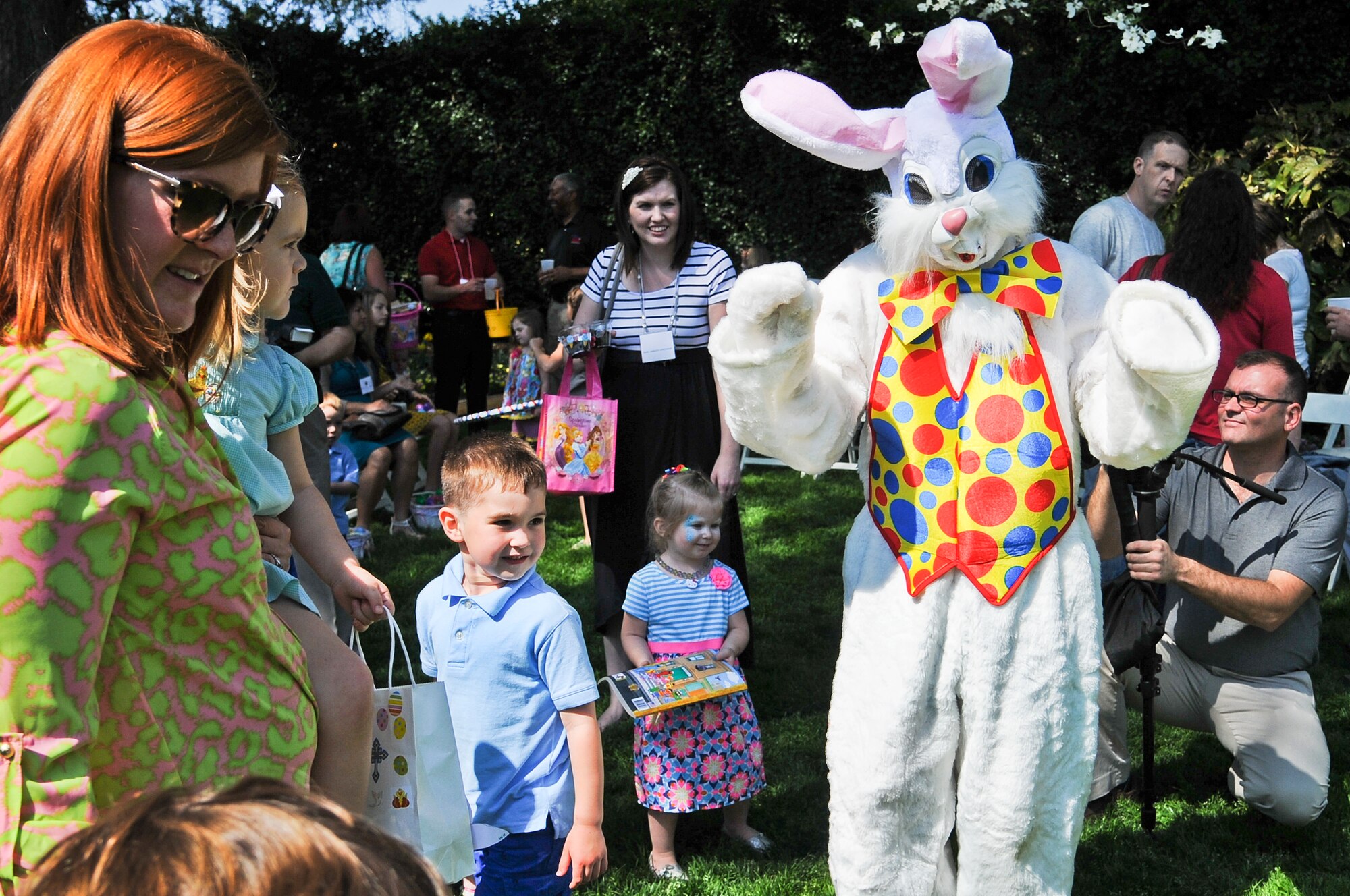 Military families from the local area including members of Team Seymour greet the Easter Bunny during the Easter egg hunt April 12, 2014, at the Governor’s Executive Mansion in Raleigh, N.C. The event was held in celebration of the Month of the Military Child and featured music, refreshments and several activities for the children, including an egg hunt, face painting, bouncy house, flower-pot planting and family photos. (U.S. Air Force photo/Tech. Sgt. Colette M. Graham)