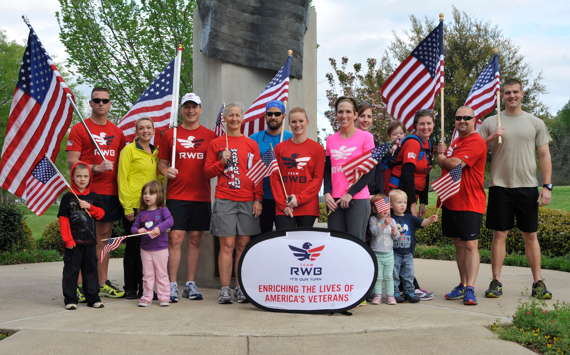 Members of Team Red, White and Blue, including local military members, pose for a photograph before a flag run at the Veteran’s Park in Shreveport, La., April 7, 2014. Groups like Team RWB, can be used to improve Airmen’s fitness levels. Team RWB’s mission is to enrich the lives of America’s veterans by connecting them to their community through physical and social activity. (U.S. Air Force Photo/Airman 1st Class Benjamin Raughton)