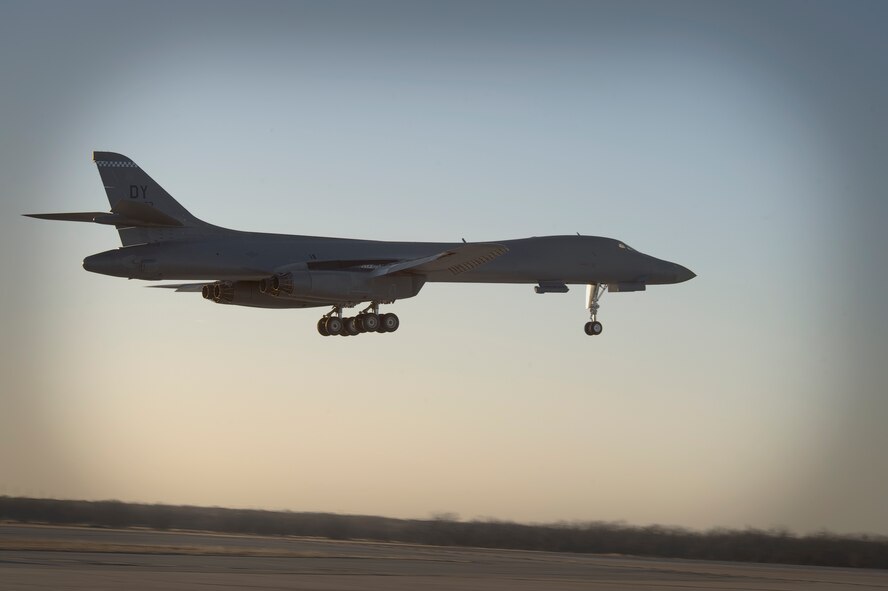 A B-1B Lancer lands Jan. 21, 2014 at Dyess Air Force Base, Texas. The B-1B's blended wing/body configuration, variable-geometry wings and turbofan afterburning engines, combine to provide long range, maneuverability and high speed while enhancing survivability. Forward wing settings are used for takeoff, landings, air refueling and in some high-altitude weapons employment scenarios. (U.S. Air Force photo by Staff Sgt. Richard Ebensberger/Released)