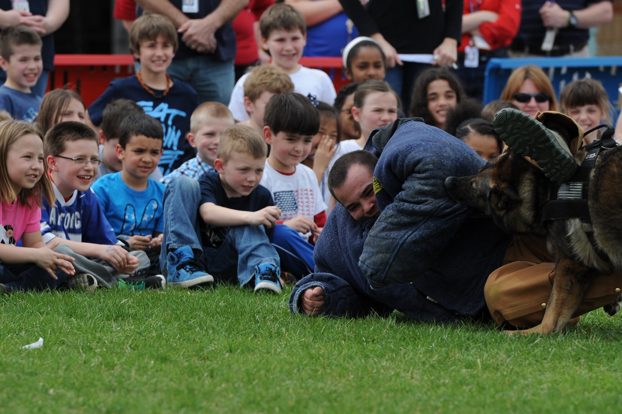 Staff Sgt. James Fligor, 375th Civil Engineer Squadron fire crew cheif, demonstrates the "jaws of life" to a Scott Elementary School student on April 11, 2014 at Scott Air Force Base, Ill. The demonstration was part of the Week of the Military Child. (U.S. Air Force photo/Senior Airman Sarah Hall-Kirchner)