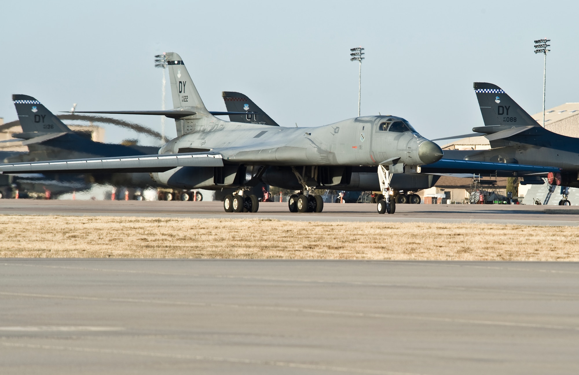A B-1B Lancer taxis down the flight line Jan. 21, 2014 at Dyess Air Force Base, Texas. Carrying the largest payload of both guided and unguided weapons in the Air Force inventory, the multi-mission B-1 is the backbone of America's long-range bomber force. (U.S. Air Force photo by Staff Sgt. Richard Ebensberger/Released)