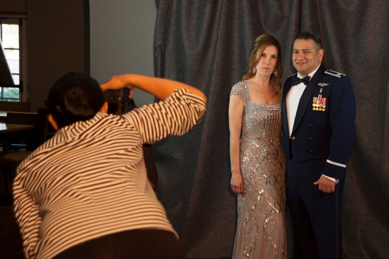 Lt. Col. Nicholas Petrone, 30th Medical Operations Squadron chief nurse, and his wife pose for a photo during the 30th Space Wing Dining Out April 11, 2014, Vandenberg Air Force Base, Calif. Members from around the base embraced traditions as they celebrated the 55th anniversary of space launches here. (U.S. Air Force photos/Airman 1st Class Yvonne Morales)