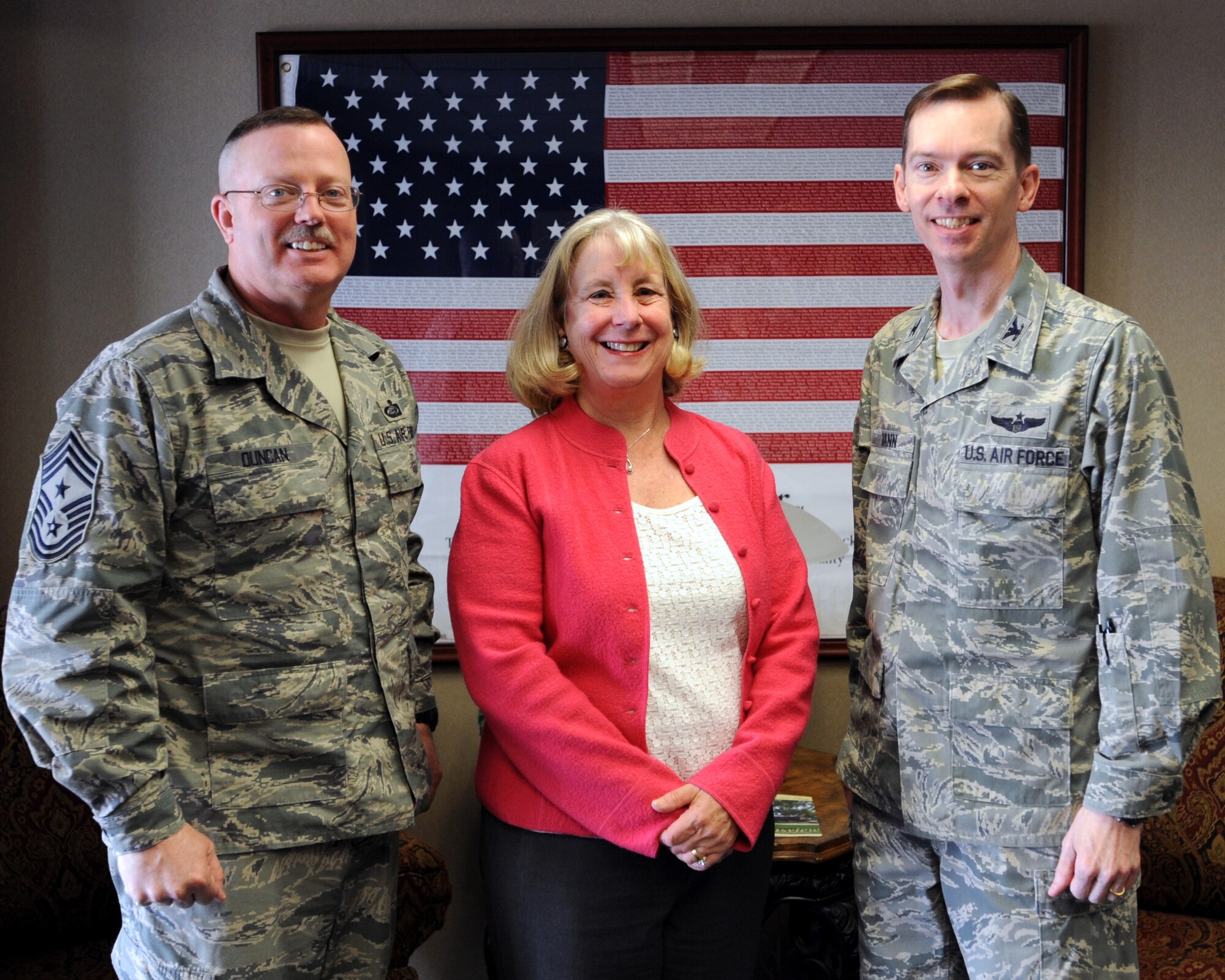 First Lady of North Dakota Betsy Dalrymple, stands with 319th Air Base Wing Command Chief Master Sgt. David Duncan and Col. Christopher Mann, 319th ABW vice commander, April 15, 2014 on Grand Forks Air Force Base, N.D. Dalrymple visited the base to discuss opportunities available to GFAFB with base leadership regarding the ND Cares program. The ND Cares program is a non-profit and volunteer-driven group for the state of North Dakota to fight veteran homelessness and suicide. (U.S. Air Force photo/Senior Airman Zachiah Roberson)
