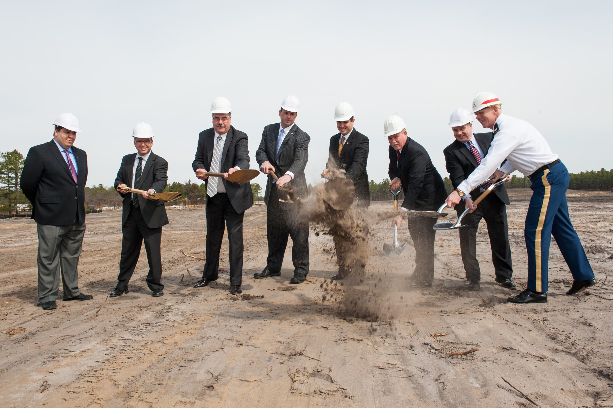 (L to R) Mr. Richard Locklear, Office of Senator Menendez congressional staffer, Mr. Charles Maraldo, US Army Communications-Electronics Research, Development and Engineering Center Flight Activity director, Mr. Robert Zanzalari, CERDEC associate director, Rep. Jon Runyan, N.J's 3rd Congressional District in Congress, Mr. Dale Ormond, U.S. Army Research, Development and Engineering Command director, Mr. Henry Muller, Intelligence and Information Warfare Directorate CERDEC director, Rep. Chris Smith, NJ's 4th Congressional District of Congress, and Col. Paul Owen, U.S. Army Corps of Engineers New York District commander, break ground for the new home of the U.S. Army's CERDEC Flight Activity hanger Apr. 11, 2014, on Joint Base McGuire-Dix-Lakehurst, N.J. The new hanger will be a state of the art Aviation Modification, Research, Development and Maintenance Facility allowing CERDEC Flight Activity to continue the mission of providing Aviation Expertise, Resources and Integration experience. (U.S. Air Force photo by Russ Meseroll/Released)