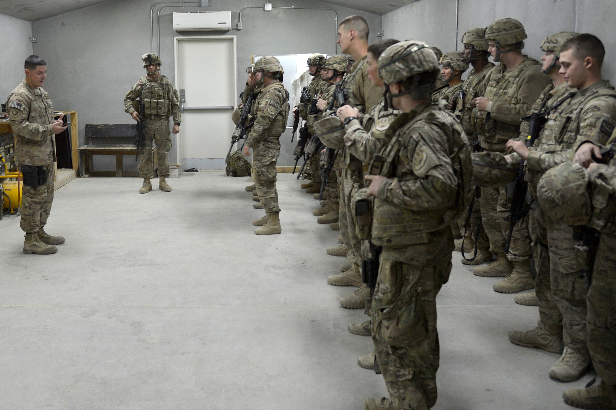 SSgt. Frank Rivas, 6th Air Mobility Wing chaplain’s assistant, talks to troops at Bagram Airfield, Afghanistan Nov. 23, 2013. There he served a six month deployment as the NCO in charge for the Expeditionary Base Defense Group Religious Support Team. (U.S. Air Force photo by Senior Airman Kayla Newman/Released)