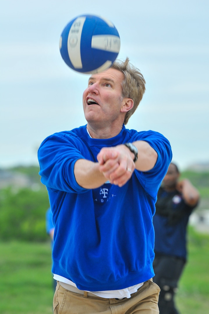 Col. Eric Payne bumps a return during the volleyball competition at the inaugural Air Force Intelligence, Surveillance and Reconnaissance Agency Field Day and Family Picnic at Security Hill's Stapleton Park April 5. The event is the unit's way of saying thanks to all who have sacrificed on its behalf. (U. S. Air Force photo by William Belcher)