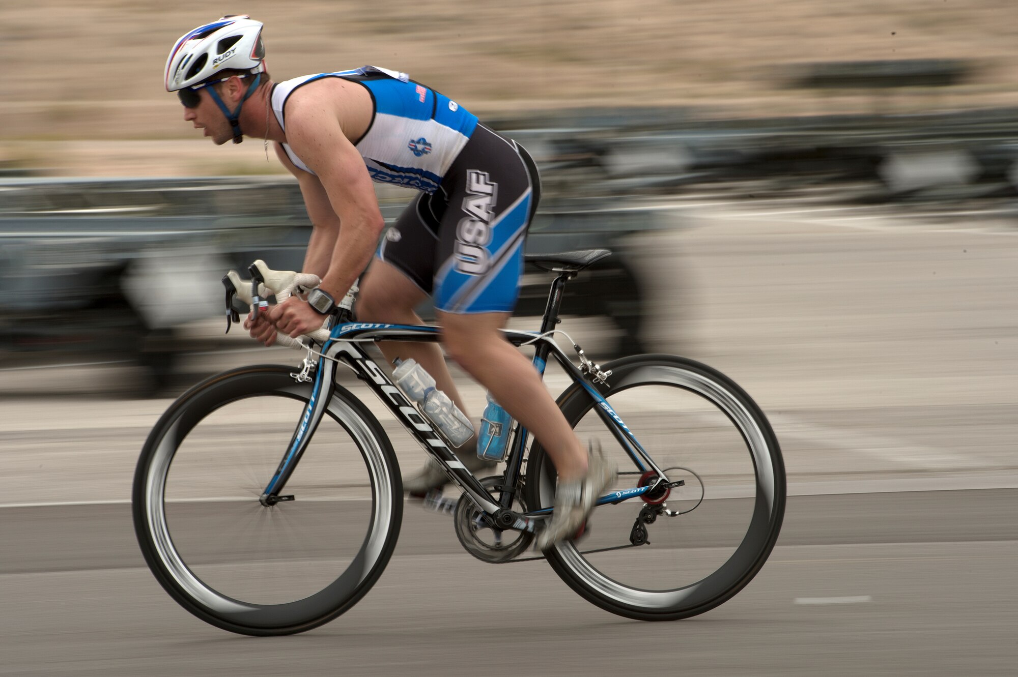 Mitchell Kieffer increases his speed while racing in the 18-mile men’s bicycle open April 9, 2014, during the Air Force Trials at Nellis Air Force Base, Nev. Kieffer, an Air Force wounded warrior, finished in first place for his category. (U.S. Air Force photo/Senior Airman Jette Carr)