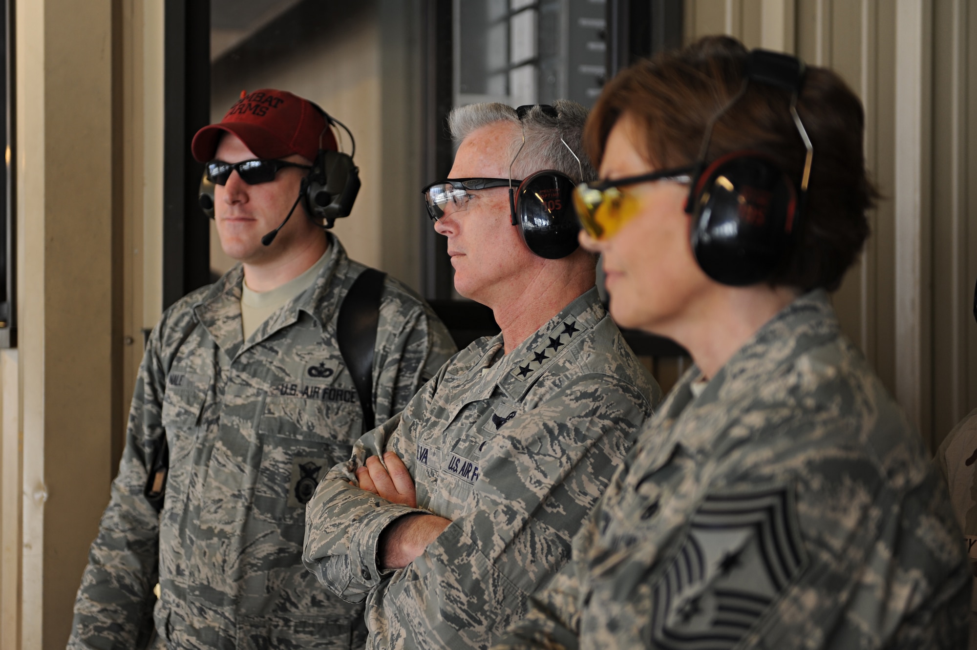 Staff Sgt. Garrett Nale, Gen. Paul Selva and Chief Master Sgt. Victoria Gamble observe security forces members during a live fire exercise during a training session at Scott Air Force Base, Ill. April 10, 2014. Members from sixteen bases and agencies gathered at Scott for a week-long training focused on higher training standards for security forces. Selva is the Air Mobility Command commander, Gamble is the AMC command chief master sergeant, and Nale is a 375th Security Forces Squadron combat arms training and maintenance member. (U.S. Air Force photo/Senior Airman Sarah Hall-Kirchner)