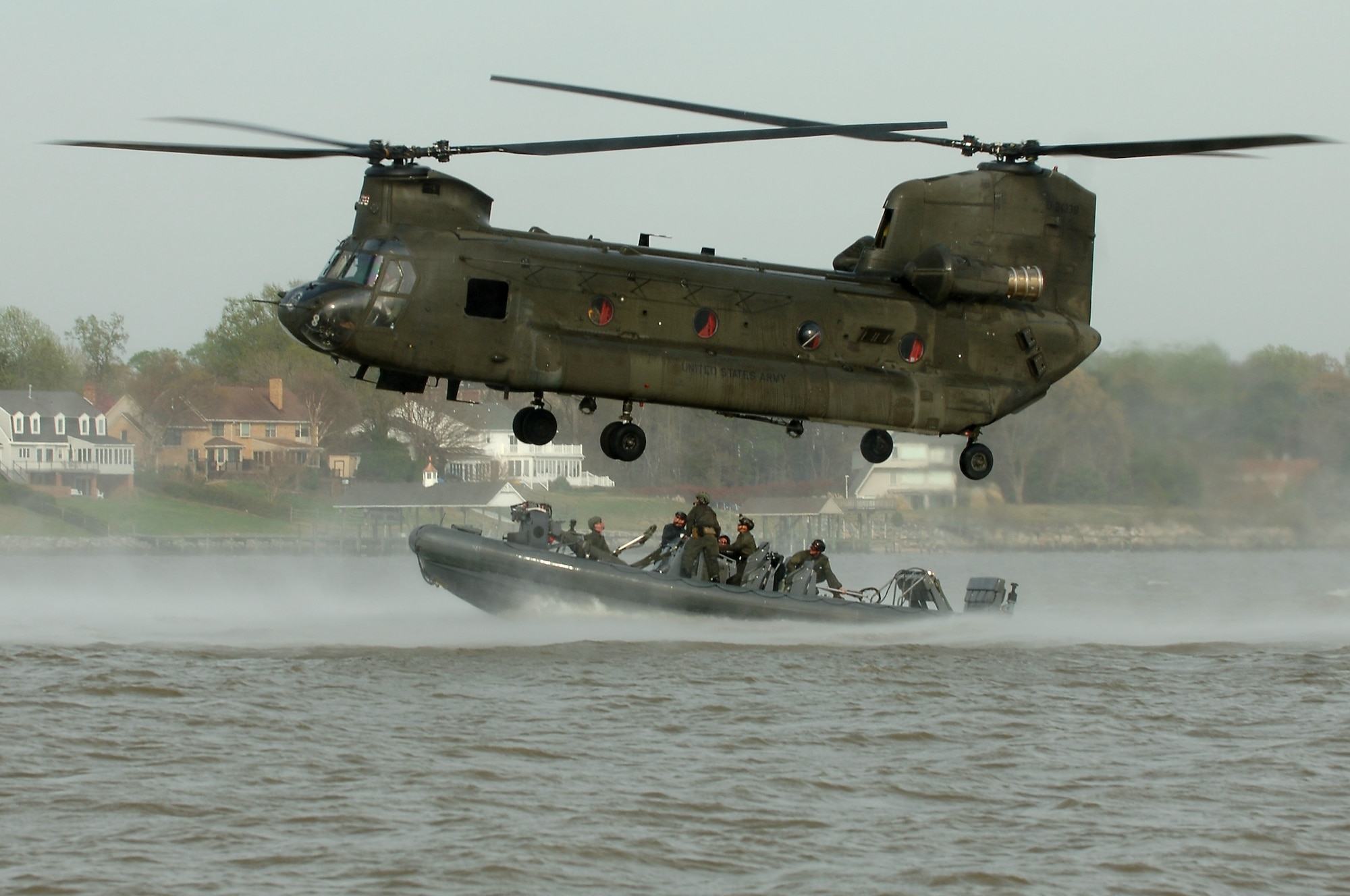 A 5-159th General Support Aviation Battalion CH-47 Chinook drops off U.S. Navy Special Boat Team 20 Sailors during a training exercise at Fort Eustis, Va., April 11, 2014. The 5-159th GSAB has worked with every branch of the military during its stay at Fort Eustis. (U.S. Air Force photo by Senior Airman Teresa J.C. Aber/Released) 
