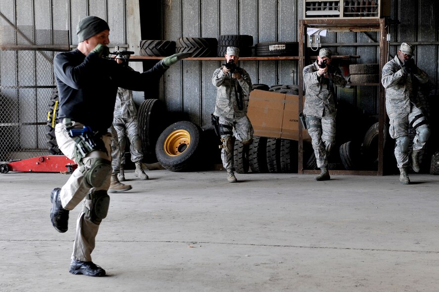 Ken Good, a former Navy SEAL, teaches Security Forces Squadron Airmen and law enforcement members multiple movements to improve their weapons handling during Progressive Combat Solutions training at Scott Air Force Base, Ill., April 8, 2014. The Progressive Combat Solutions trains military and law enforcement personnel in decision making process originally benchmarked by the Air Force known as observe, orient, decide and act. The Air Mobility Command and the 375th Security Force Squadron hosted this training with the goal of implementing it across the AMC command in the future. (U.S. Air Force photo/Airman 1st Class Kiana Brothers)