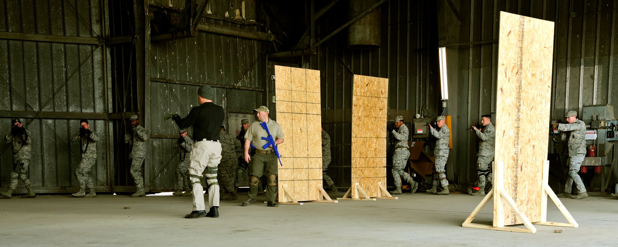 Ken Good, a former Navy SEAL, instructs Security Forces Squadron Airmen and law enforcement members on safe weapons handling procedures during Progressive Combat Solutions training at Scott Air Force Base, Ill., April 8, 2014. The Progressive Combat Solutions trains military and law enforcement personnel in decision making process originally benchmarked by the Air Force known as observe, orient, decide and act. The Air Mobility Command and the 375th Security Force Squadron hosted this training with the goal of implementing it across the AMC command in the future. (U.S. Air Force photo/Staff Sgt. Stephenie Wade)