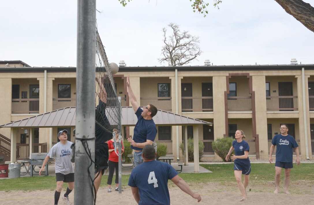 Col. Vince Becklund, 58th Special Operations Wing commander, makes a play at the net during the Chiefs vs. Eagles volleyball game April 11 at Kirtland. Eagles won the match, capturing bragging rights until they play again. (Photo by Dennis Carlson)