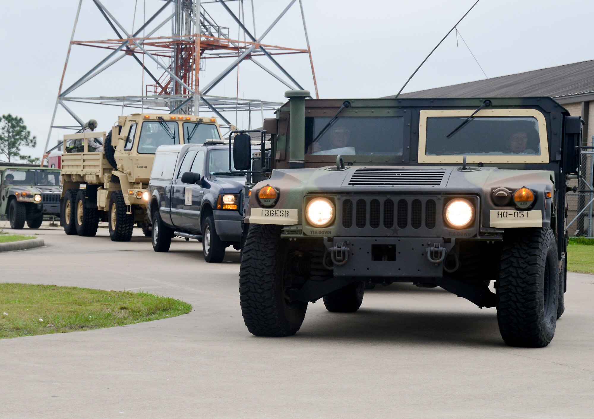Members of the 147th Civil Engineering Squadron depart for convoy training during an Operational Readiness Exercise, April, 3, 2014 at Ellington Field Joint Reserve Base, Houston, TX. The Airmen were evaluated on their actions during the training with simulated improvised explosive devices and vehicle malfunctions.