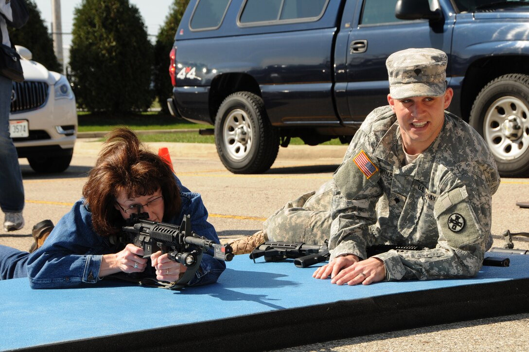 An employer takes aim with an M-4 rifle during Operation Joint Engagement at the Springfield Air National Guard Base, April 10. More than 30 employers participated and received unique hands-on experience with different equipment, weapons and a ride in a UH-60 Blackhawk helicopter. (Ohio Air National Guard photo by Senior Master Sgt. Joseph Stahl/Released)
