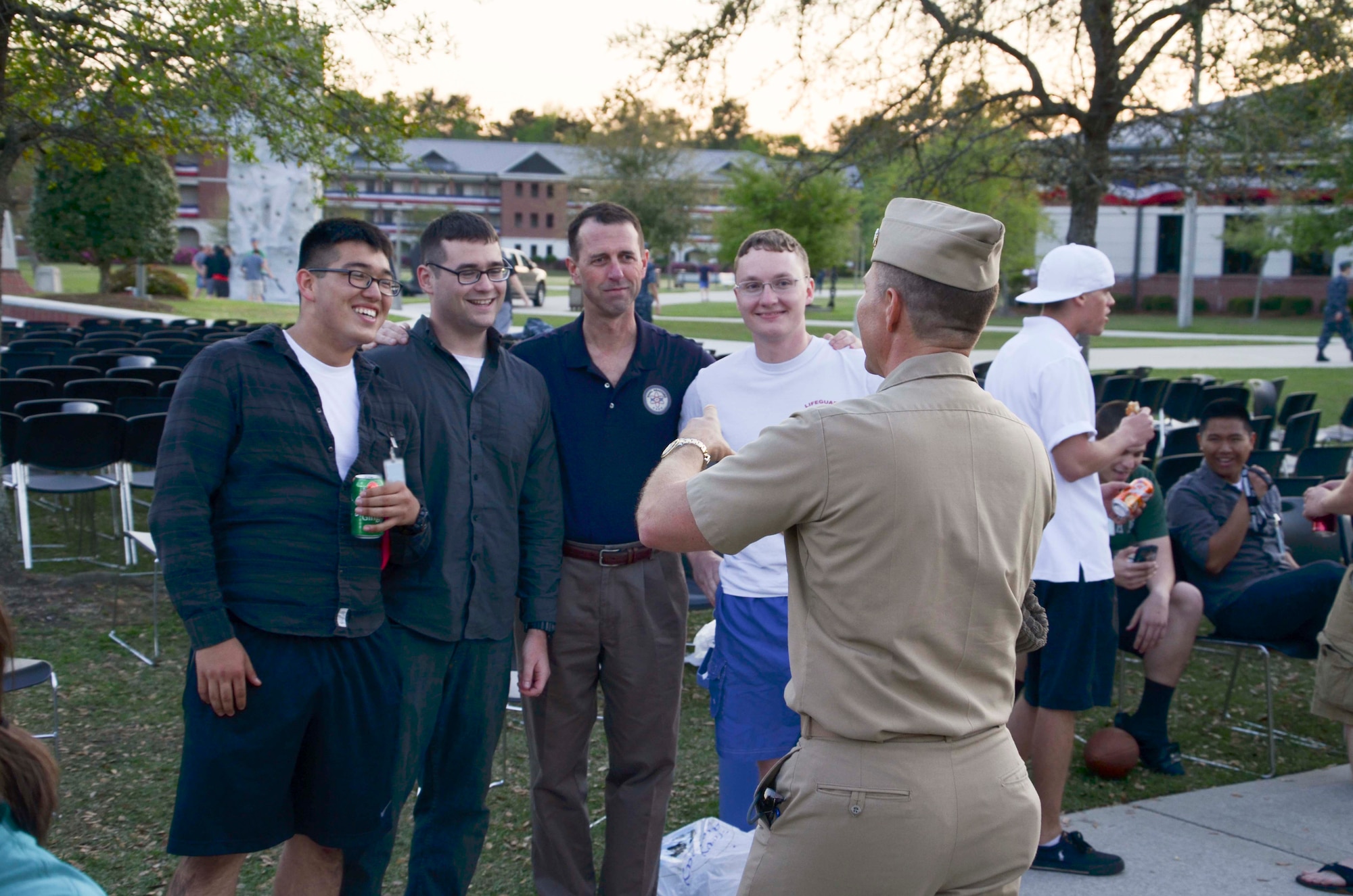 Admiral John Richardson, Director of the Naval Nuclear Propulsion Program (center), enjoys gathering for a group photo with the Naval Nuclear Power Training Command’s Sexual Assault Prevention and Response victim advocates April 11, 2014, during the NNPTC bi-monthly barracks bash cookout on Joint Base Charleston – Weapons Station, S.C. During the event, the SAPR team helped raise $2,300 for victim assistance and sexual assault education. (U.S .Navy photo/ Petty Officer 3rd Class Jason Pastrik)