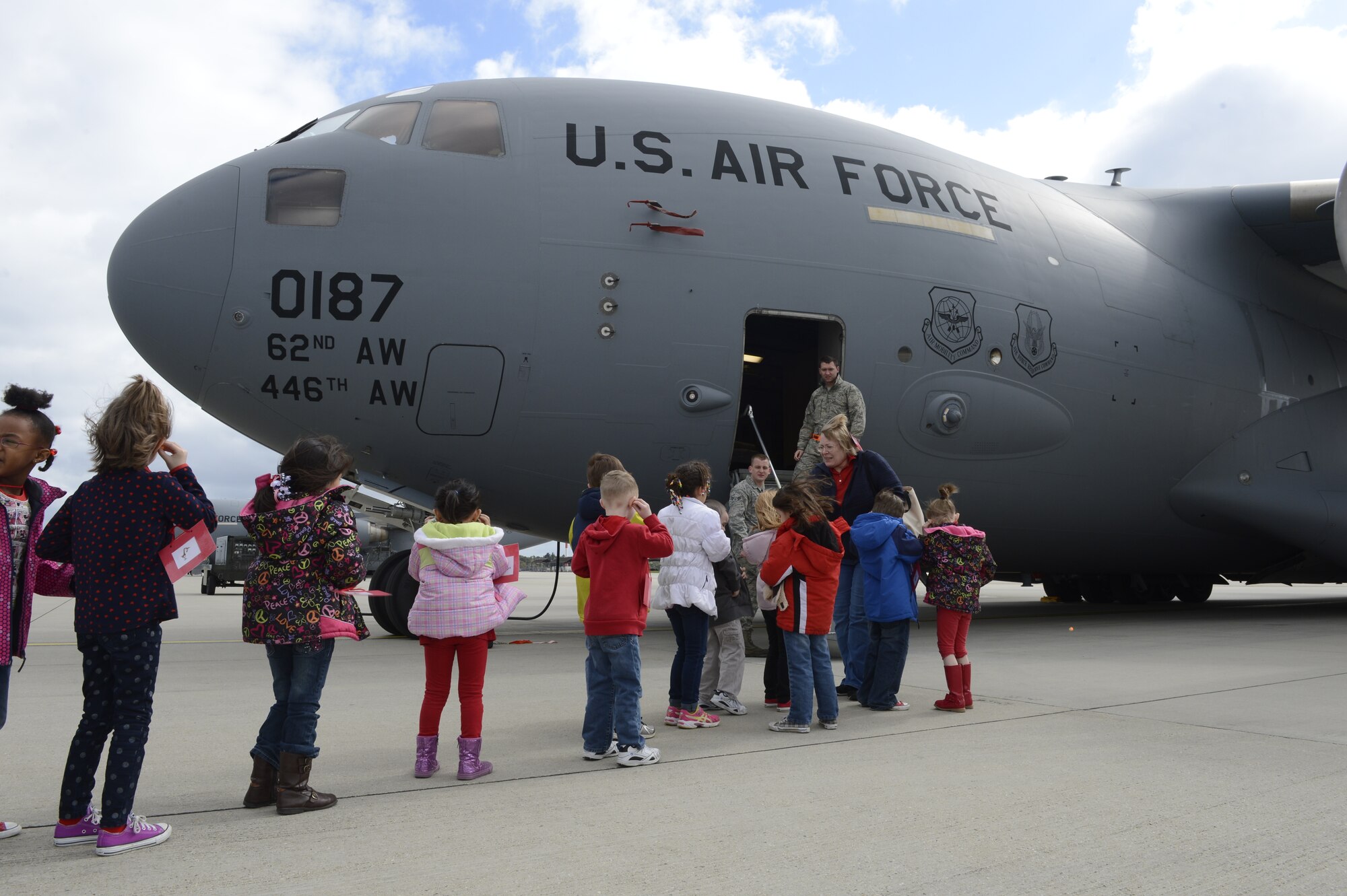 Students from Spangdahlem Elementary tour a C-17 Globemaster III cargo aircraft during Kids' Deployment Day at Spangdahlem Air Base, Germany, April 15, 2014. The students participated in a simulated deployment to Madagascar to build a school for children. (U.S. Air Force photo by Staff Sgt. Christopher Ruano/Released)