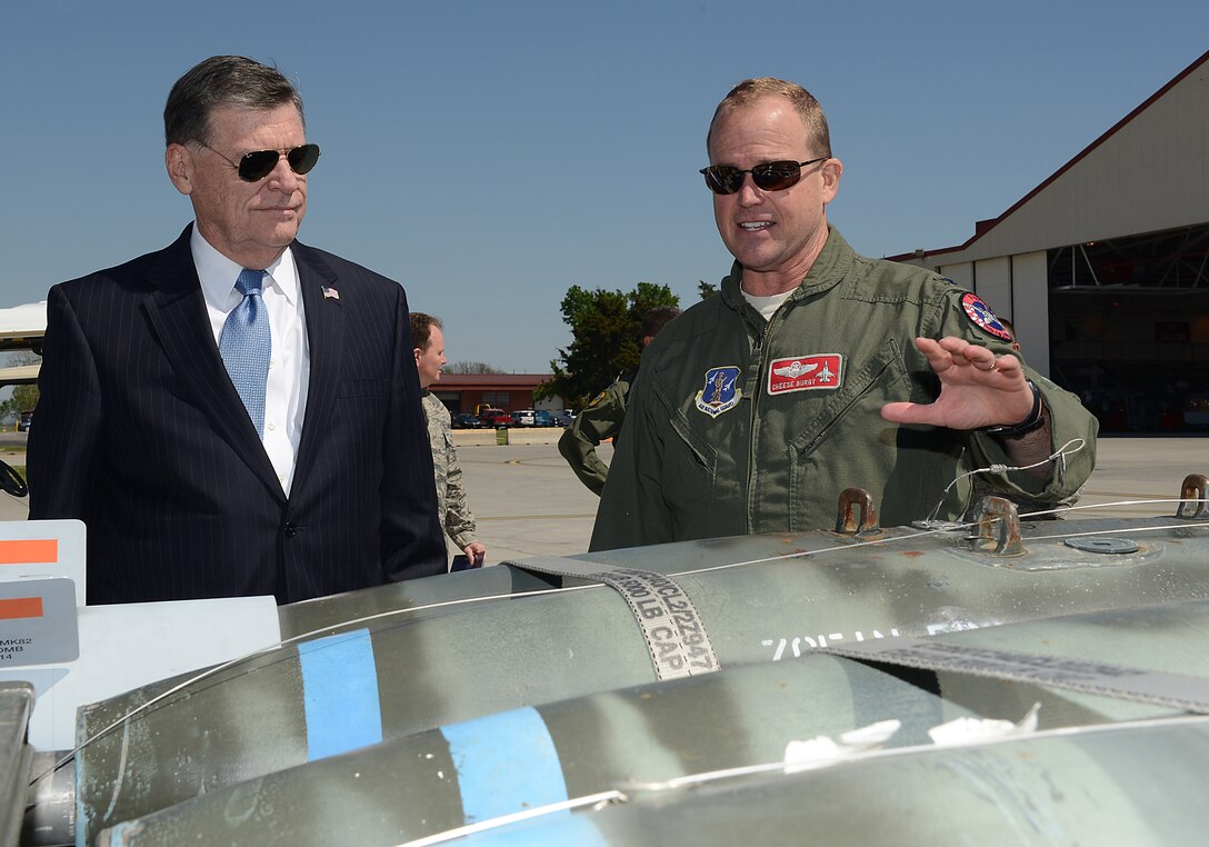 Colonel David B. Burgy, 138th Fighter Wing Commander, briefs Oklahoma Congressman Tom Cole, of the fourth district, about the variety of weapons that can be deployed by the F-16 Fighting Falcon, during Cole's visit to the Tulsa Air National Guard base, 15 April 2014.  Representative Cole along with members of his staff visited the 138th FW to preview their projected facility enhancements as wells as learn more about federal and state operational capabilities.  (U.S. National Guard photo by Senior Master Sgt.  Preston L. Chasteen/Released)