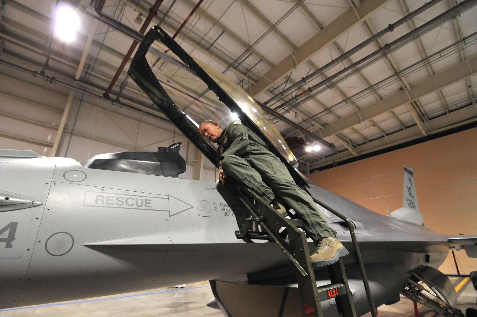 Lt. Gen. William H. Etter, Commander of Continental U.S. North American Aerospace Defense Command Region - 1st Air Force, inspects an F-16C Fighting Falcon while on a tour of the 177th Fighter Wing Aerospace Control Alert (ACA) site at the Atlantic City Air Guard Base facility in Egg Harbor Township, N.J. on April 2, 2014. (U.S. Air National Guard photo by Master Sgt. Andrew J. Moseley/Released)