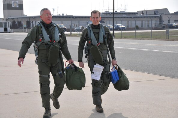 From left, Lt. Gen. William H. Etter, Commander of Continental U.S. North American Aerospace Defense Command Region - 1st Air Force, and Capt. Mike Nicosan, F-16 fighter pilot from the New Jersey Air National Guard's 177th Fighter Wing at the Atlantic City Air Guard Base, step to fly F-16C Fighting Falcons on April 3, 2014. (U.S. Air National Guard photo by Master Sgt. Andrew J. Moseley/Released)