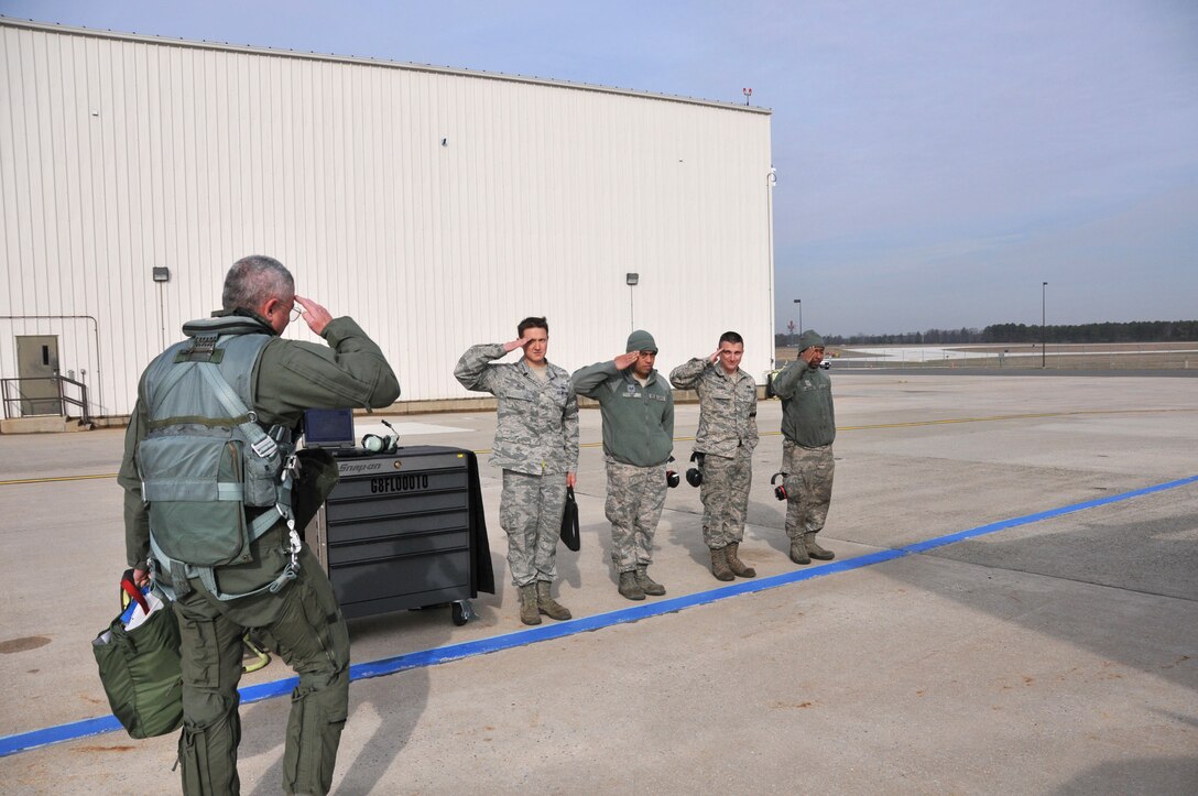 Lt. Gen. William H. Etter, Commander of Continental U.S. North American Aerospace Defense Command Region - 1st Air Force, salutes crew chiefs from the New Jersey Air National Guard's 177th Fighter Wing at the Atlantic City Air Guard Base, as he steps to fly one of the unit's F-16C Fighting Falcons on April 3, 2014. (U.S. Air National Guard photo by Master Sgt. Andrew J. Moseley/Released)