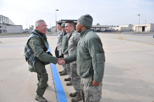 Lt. Gen. William H. Etter, Commander of Continental U.S. North American Aerospace Defense Command Region - 1st Air Force, greets crew chiefs from the New Jersey Air National Guard's 177th Fighter Wing at the Atlantic City Air Guard Base, as he steps to fly one of the unit's F-16C Fighting Falcons on April 3, 2014. (U.S. Air National Guard photo by Master Sgt. Andrew J. Moseley/Released)