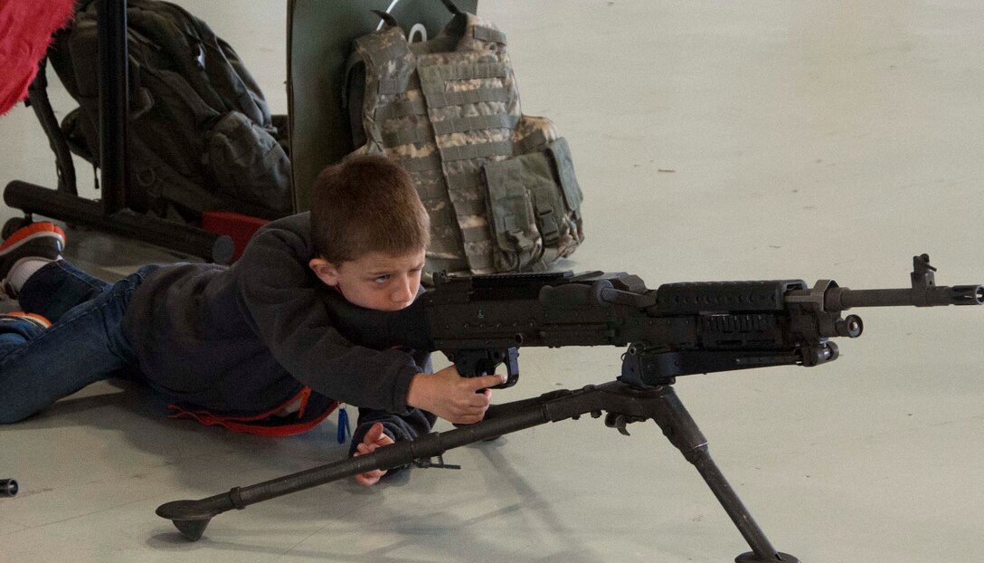 Military dependent children get hands on with weapons during Operations KIDS (Kids Investigating Deployment Services) April 5, at Sheppard Air Force Base. Operation KIDS gave children an opportunity to achieve a better perspective and understanding on what their parents go through during a deployment. (U.S. Air Force photo/Airman 1st Class Robert L. McIlrath)