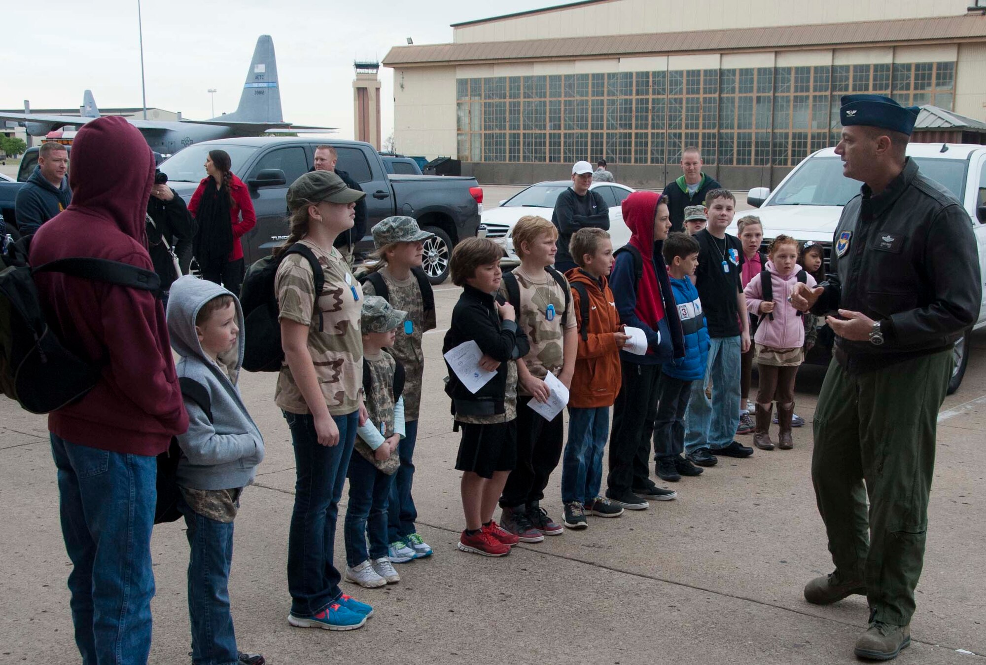 Col. Lance Bunch, 80th Flying Training Wing commander, briefs children arriving at “Base X” for Operation KIDS (Kids Investigating Deployment Services), on what their mission will be April 5, at Sheppard Air Force Base, Texas. Operation KIDS gave children an opportunity to achieve a better perspective and understanding on what their parents go through during a deployment. (U.S. Air Force photo/Airman 1st Class Robert L. McIlrath)