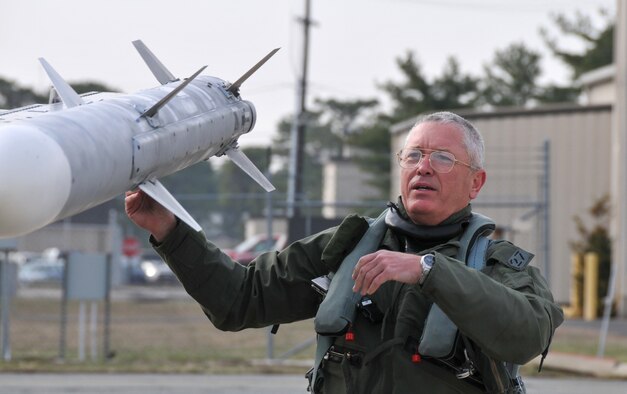 Lt. Gen. William H. Etter, Commander of Continental U.S. North American Aerospace Defense Command Region - 1st Air Force, performs pre-flight checks on an F-16 Fighting Falcon from the New Jersey Air National Guard's 177th Fighter Wing at the Atlantic City Air Guard Base, N.J. on April 3, 2014. (U.S. Air National Guard photo by Master Sgt. Andrew J. Moseley/Released)