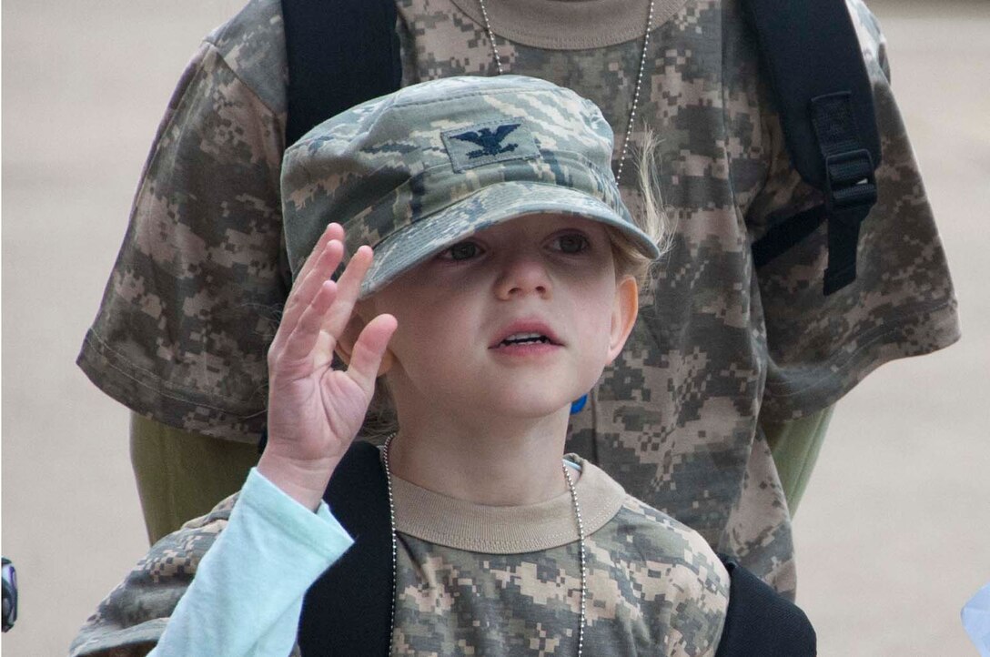 Military dependent children ask questions about the equipment and gear they saw during Operation KIDS (Kids Investigating Deployment Services) April 5, at Sheppard Air Force Base. Operation KIDS gave children an opportunity to achieve a better perspective and understanding on what their parents go through during a deployment. (U.S. Air Force photo/Airman 1st Class Robert L. McIlrath)