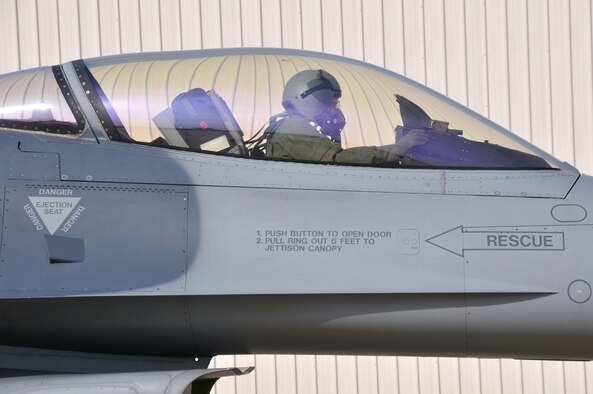 Lt. Gen. William H. Etter, Commander of Continental U.S. North American Aerospace Defense Command Region - 1st Air Force, performs pre-flight checks while piloting an F-16 Fighting Falcon from the New Jersey Air National Guard's 177th Fighter Wing at the Atlantic City Air Guard Base, N.J. on April 3, 2014. (U.S. Air National Guard photo by Master Sgt. Andrew J. Moseley/Released)