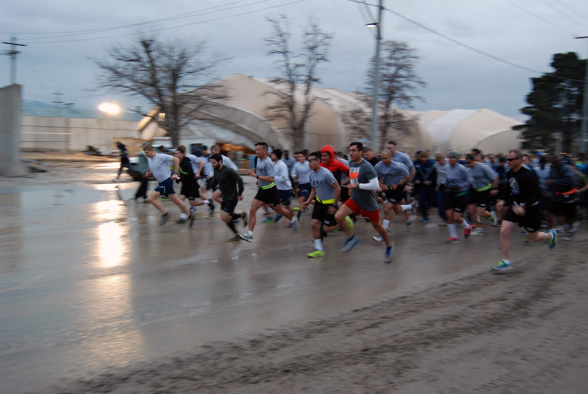 Runners launch off the starting line at the Sexual Assault Awareness Month 5K at Bagram Airfield, Afghanistan, April 4, 2014. There were over 600 participants at the event. (U.S. Air Force photo by Capt. Brian Wagner/Released)