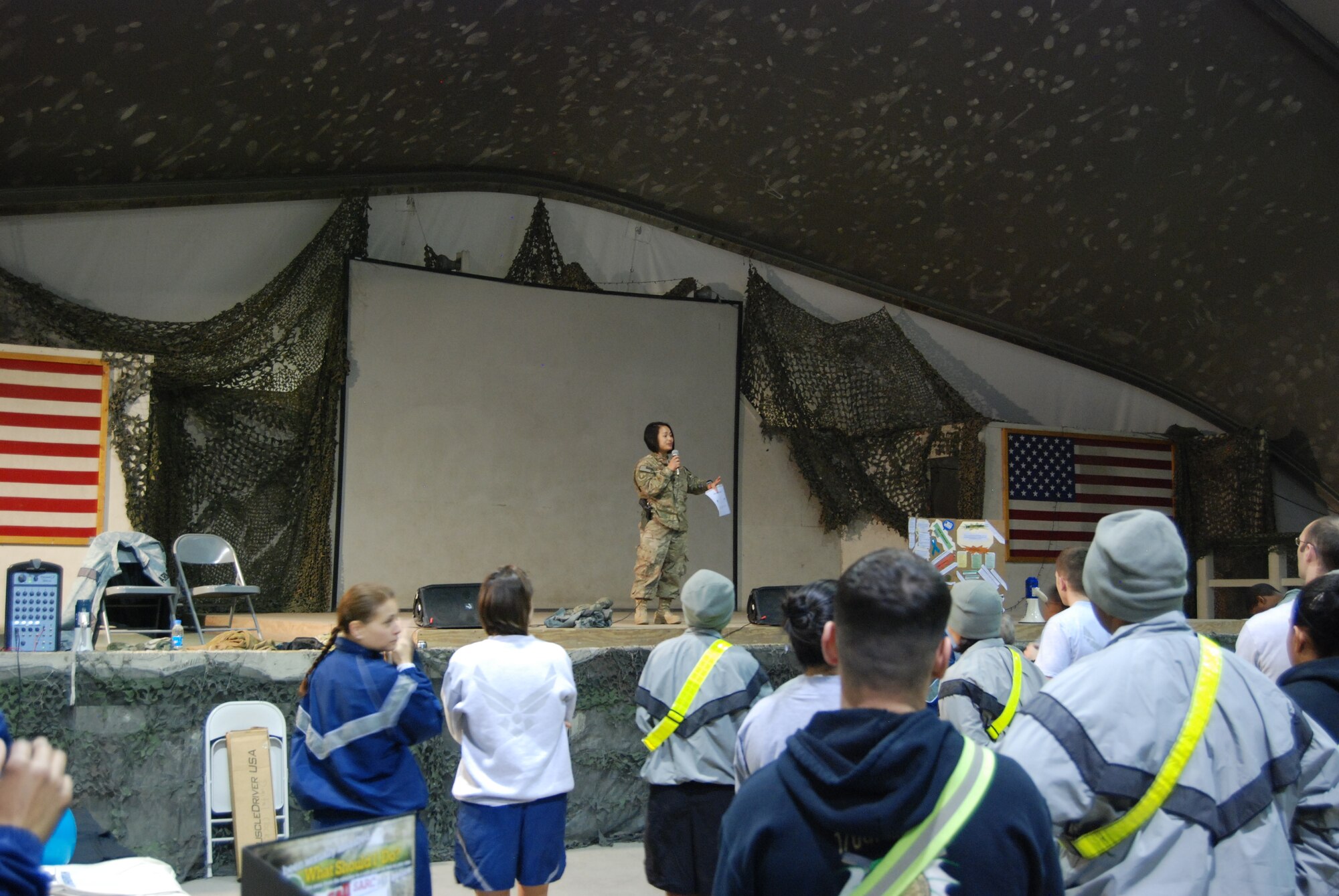 Maj. December Garcia, 455th Air Expeditionary Wing Sexual Assault Response Coordinator gives a safety briefing prior to the Sexual Assault Awareness Month 5K run at Bagram Airfield, Afghanistan, April 4, 2014. There were over 600 participants at the event. (U.S. Air Force photo by Capt. Brian Wagner/Released)