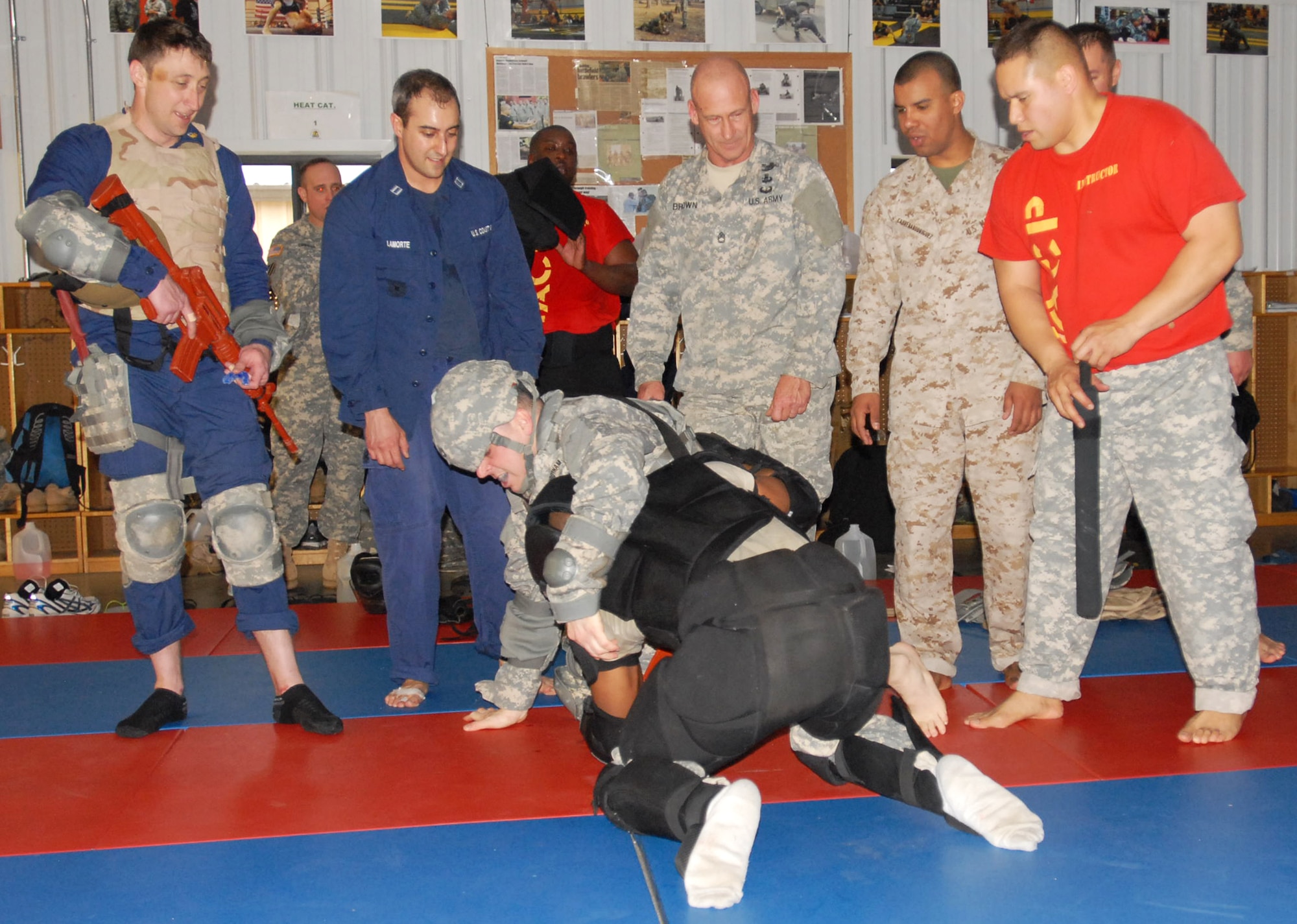 Students look on as their classmate attempts to thwart an ‘enemy’ during 3-314th Field Artillery Battalion Modern Army Combatives Program, Level I certification held Mar. 10-14, at Joint Base McGuire-Dix-Lakehurst, N.J. MACP is used to train leaders and Soldiers in close quarters combat. (U.S. Army photo by Capt. Kelvin Scott/Released)