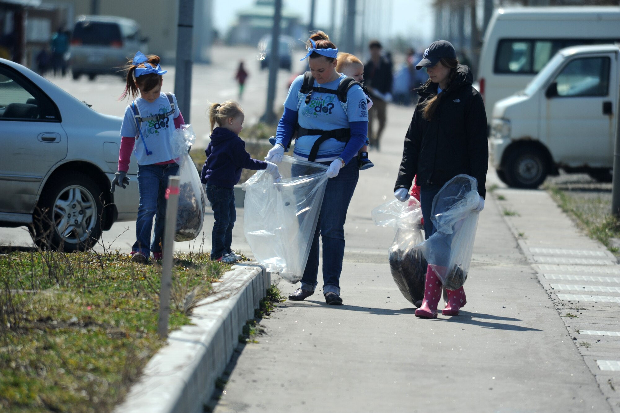Angel DeBardeleben, wife of Staff Sgt. Martin DeBardeleben, 35th Aircraft Maintance Squadron aerospace propulsion craftsmen, collects trash with her Daisy Girl Scout troops during the 17th Annual Misawa Fish Port Cleanup in Misawa City, Japan, April 12, 2014. Around 25 Girl Scouts assisted in the cleanup of about 9,000 pounds trash in support of Earth Day and Japan’s Greenery Day. (U.S. Air Force Tech. Sgt. April Quintanilla)